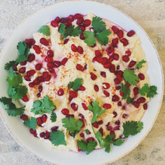 Hummus with pomegranate, cayenne pepper and coriander